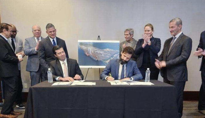 Atlantic Shores CEO Joris Veldhoven seated at table signing of a Letter of Intent (LOI) between the New Jersey Economic Development Authority (NJEDA) and Atlantic Shores Offshore Wind, LLC 